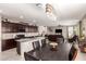 Modern kitchen with dark cabinets, granite counters and an island at 18475 W Via Del Sol --, Surprise, AZ 85387