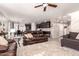 Open living room with leather couches and kitchen view at 18475 W Via Del Sol --, Surprise, AZ 85387