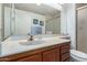 Clean bathroom with a single sink vanity and shower at 19633 N Marble Dr, Sun City West, AZ 85375