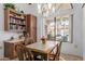 Bright breakfast nook features built-in cabinetry and a view of the backyard at 19633 N Marble Dr, Sun City West, AZ 85375