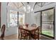 Small dining area with a wooden table and four chairs near the kitchen at 19633 N Marble Dr, Sun City West, AZ 85375