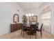 Formal dining room with a round table and six chairs at 19633 N Marble Dr, Sun City West, AZ 85375