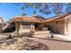 Single-story home with a fountain and desert landscaping at 19633 N Marble Dr, Sun City West, AZ 85375