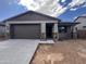 Charming single-story home with a two-car garage and stone accents in a well-planned community at 20612 N 226Th Dr, Surprise, AZ 85387
