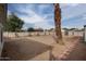 Spacious backyard with gravel, palm tree, and brick pathway at 2112 W Mulberry Dr, Phoenix, AZ 85015