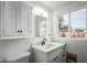 Clean bathroom with white vanity, quartz countertop, and updated fixtures at 2112 W Mulberry Dr, Phoenix, AZ 85015