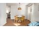 Dining area with a round table, four chairs, and hardwood floors at 2112 W Mulberry Dr, Phoenix, AZ 85015