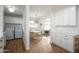 Bright dining area adjacent to kitchen and laundry, featuring a round table and chairs at 2112 W Mulberry Dr, Phoenix, AZ 85015