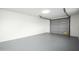 Spacious garage with gray epoxy floor and automatic opener at 2112 W Mulberry Dr, Phoenix, AZ 85015