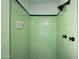 Updated shower with light green tile and modern fixtures at 2112 W Mulberry Dr, Phoenix, AZ 85015