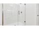 Modern glass shower with white marble tiling and updated shower fixtures at 2316 W Moody Trl, Phoenix, AZ 85041