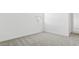 Bright bedroom featuring neutral carpet and white walls at 2316 W Moody Trl, Phoenix, AZ 85041