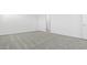 Spacious bedroom with neutral carpet, white walls, and doorway leading to another room at 2316 W Moody Trl, Phoenix, AZ 85041