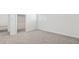Bright bedroom featuring neutral carpet, white walls, and a closet at 2316 W Moody Trl, Phoenix, AZ 85041