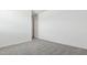 Bright bedroom featuring neutral carpet and white walls at 2316 W Moody Trl, Phoenix, AZ 85041