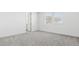 Neutral-carpeted bedroom with two windows and view at 2316 W Moody Trl, Phoenix, AZ 85041