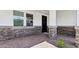 The front entrance has brick pavers and columns wrapped in stone at 2316 W Moody Trl, Phoenix, AZ 85041