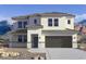 Two-story house with a modern design, attached garage, and desert landscaping at 2316 W Moody Trl, Phoenix, AZ 85041