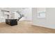 Kitchen with dark island and a staircase leading to the second floor at 2316 W Moody Trl, Phoenix, AZ 85041