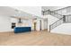 Open floor plan featuring the kitchen and a staircase with black metal railings at 2316 W Moody Trl, Phoenix, AZ 85041