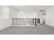 Second floor loft featuring neutral carpet and a black iron railing at 2316 W Moody Trl, Phoenix, AZ 85041