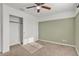 Bedroom with ceiling fan and sliding door closet at 2327 W Branham Ln, Phoenix, AZ 85041