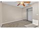 Bedroom with ceiling fan and mirrored closet doors at 2327 W Branham Ln, Phoenix, AZ 85041