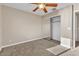 Bedroom with ceiling fan and mirrored closet doors at 2327 W Branham Ln, Phoenix, AZ 85041