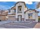 Two-story house with stone accents and a two-car garage at 2327 W Branham Ln, Phoenix, AZ 85041