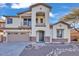 Two-story house with stone accents and a two-car garage at 2327 W Branham Ln, Phoenix, AZ 85041