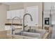 Modern double kitchen sink with stainless steel faucet at 2327 W Branham Ln, Phoenix, AZ 85041