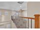 Spacious loft area overlooking the main floor with wood railing at 2327 W Branham Ln, Phoenix, AZ 85041