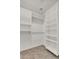 Spacious walk-in closet with ample shelving and hanging space at 2327 W Branham Ln, Phoenix, AZ 85041