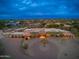 Aerial view of a luxury home with a large yard and basketball court at 23414 N 84Th Pl, Scottsdale, AZ 85255