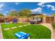 Landscaped backyard with hot tub, games, and putting green at 23414 N 84Th Pl, Scottsdale, AZ 85255