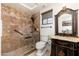 Elegant bathroom with walk-in shower, vanity, and decorative mirror at 23414 N 84Th Pl, Scottsdale, AZ 85255