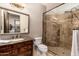 Bathroom with marble vanity and walk-in shower at 23414 N 84Th Pl, Scottsdale, AZ 85255