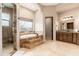 Spa-like bathroom with a large soaking tub and walk-in shower at 23414 N 84Th Pl, Scottsdale, AZ 85255