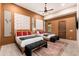 Bedroom with two queen beds, a ceiling fan, and rustic decor at 23414 N 84Th Pl, Scottsdale, AZ 85255