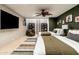 Bedroom with two twin beds, green accent wall, and a ladder to loft at 23414 N 84Th Pl, Scottsdale, AZ 85255