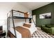 Bedroom with bunk beds and green accent wall at 23414 N 84Th Pl, Scottsdale, AZ 85255