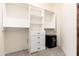 Large walk-in closet with built-in shelves and a safe at 23414 N 84Th Pl, Scottsdale, AZ 85255