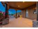 Covered patio with stone columns and a view of the backyard at 23414 N 84Th Pl, Scottsdale, AZ 85255