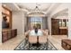 Formal dining room showcasing a long wooden table and chandelier at 23414 N 84Th Pl, Scottsdale, AZ 85255