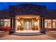 Grand entryway with a wrought iron door and stone accents at 23414 N 84Th Pl, Scottsdale, AZ 85255