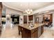 Island kitchen with granite countertops and a view into the dining room at 23414 N 84Th Pl, Scottsdale, AZ 85255