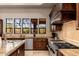 Well-equipped kitchen featuring granite countertops and custom cabinetry at 23414 N 84Th Pl, Scottsdale, AZ 85255