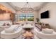 Bright and airy living room with a neutral color palette and large windows at 23414 N 84Th Pl, Scottsdale, AZ 85255