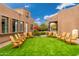 Relaxing patio with comfortable seating and lush greenery at 23414 N 84Th Pl, Scottsdale, AZ 85255