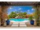 Inviting pool with a waterfall feature and a pergola at 23414 N 84Th Pl, Scottsdale, AZ 85255